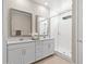 Stylish bathroom features double sinks, white cabinets, and a glass-enclosed shower at 9829 E Talon Ave, Mesa, AZ 85212