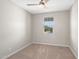 Bright bedroom with carpet flooring, neutral walls, and natural light from a large window at 9829 E Talon Ave, Mesa, AZ 85212