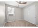 Bedroom with carpet, ceiling fan, window with blinds, and closet at 9829 E Talon Ave, Mesa, AZ 85212
