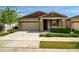 Charming single-story home with a well-maintained front yard and a two-car garage at 9829 E Talon Ave, Mesa, AZ 85212