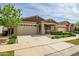 Beautiful single-story home featuring a two-car garage and manicured landscaping at 9829 E Talon Ave, Mesa, AZ 85212