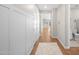 Bright hallway with wood-look floors and neutral walls leading to rooms at 9829 E Talon Ave, Mesa, AZ 85212