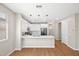 Bright open-concept kitchen with white cabinets and a large center island at 9829 E Talon Ave, Mesa, AZ 85212