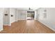 Spacious living room with wood-look floors and a sliding glass door to the backyard at 9829 E Talon Ave, Mesa, AZ 85212