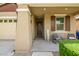 Welcoming front porch with seating and decorative 'SPRING' sign at 9829 E Talon Ave, Mesa, AZ 85212