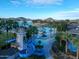 Beautiful aerial view of community pool, water slides, beach and lake, offering recreation and scenic beauty at 10130 S 185Th Dr, Goodyear, AZ 85338