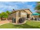 Beautiful backyard with pool, well manicured lawn and covered patio at 10130 S 185Th Dr, Goodyear, AZ 85338