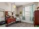 Charming bedroom with decorative vanity, chair and bright window at 10130 S 185Th Dr, Goodyear, AZ 85338