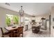 Bright, updated kitchen features stainless steel appliances and a charming eat-in dining table at 10130 S 185Th Dr, Goodyear, AZ 85338