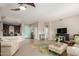 Open living room showcases a nearby bar area and an entryway with a turquoise door at 10130 S 185Th Dr, Goodyear, AZ 85338