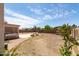 Backyard features a covered patio, built in grill, concrete patio, and block wall fence at 10909 W Frier Dr, Glendale, AZ 85307