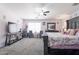 A light-filled bedroom featuring two chairs near the window, complemented by a comfortable bed at 10909 W Frier Dr, Glendale, AZ 85307