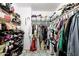 Organized walk-in closet with ample storage shelves and racks for efficient storage at 10909 W Frier Dr, Glendale, AZ 85307