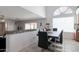 Bright dining area with large window and stylish table set for a delightful meal at 10909 W Frier Dr, Glendale, AZ 85307