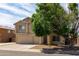 Charming two-story home featuring a spacious three-car garage and mature shade tree at 10909 W Frier Dr, Glendale, AZ 85307
