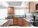 Close up of the kitchen featuring granite countertops, stainless appliances and plenty of storage at 10909 W Frier Dr, Glendale, AZ 85307