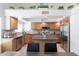 Open concept kitchen with stainless steel appliances and ample counter space at 10909 W Frier Dr, Glendale, AZ 85307