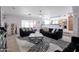 Open living room with modern decor, stylish furniture, and plenty of natural light at 10909 W Frier Dr, Glendale, AZ 85307