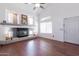 Bright living room with vaulted ceilings, modern fireplace, and ample natural light at 10909 W Frier Dr, Glendale, AZ 85307