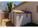 This backyard has a shed with a metal roof and siding at 10909 W Frier Dr, Glendale, AZ 85307