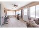 Enclosed sunroom featuring natural light and a versatile space for leisure and hobbies at 10909 W Frier Dr, Glendale, AZ 85307