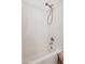 Bathroom with a sleek, white subway tiled shower and neutral colored walls at 14575 W Mountain View Blvd # 11308, Surprise, AZ 85374