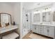 Modern bathroom with dual vanity, frameless glass shower, and stylish fixtures at 14575 W Mountain View Blvd # 11308, Surprise, AZ 85374
