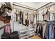 Walk-in closet with ample storage, shelving, and organized hanging space at 14575 W Mountain View Blvd # 11308, Surprise, AZ 85374