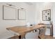 Minimalist dining area with modern decor, a stylish wooden table, and neutral tones at 14575 W Mountain View Blvd # 11308, Surprise, AZ 85374