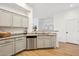 Updated kitchen features stainless steel dishwasher, granite countertops and ample cabinet space at 14575 W Mountain View Blvd # 11308, Surprise, AZ 85374