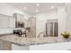 Stylish kitchen featuring granite counters, stainless steel appliances, and bright lighting at 14575 W Mountain View Blvd # 11308, Surprise, AZ 85374