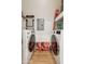Well-organized laundry room featuring a washer, dryer, and storage space at 14575 W Mountain View Blvd # 11308, Surprise, AZ 85374