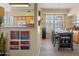 Dining area features decorative wall art and flows into the kitchen at 14950 W Mountain View Blvd # 7111, Surprise, AZ 85374