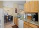 Kitchen with a breakfast bar overlooking the dining area at 14950 W Mountain View Blvd # 7111, Surprise, AZ 85374