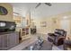 Spacious living room with views into the dining area and kitchen at 14950 W Mountain View Blvd # 7111, Surprise, AZ 85374