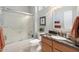 Bathroom with granite countertop vanity, bathtub and glass door enclosed shower at 15133 W Wildfire Dr, Surprise, AZ 85374
