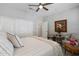 Comfortable bedroom with ceiling fan, closet, area rug and natural light at 15133 W Wildfire Dr, Surprise, AZ 85374