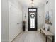 Stylish foyer featuring a decorative rug, bench seating, and modern lighting fixtures at 15133 W Wildfire Dr, Surprise, AZ 85374