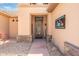Close-up of the front door with decorative wreath, set in a stone-accented facade at 15133 W Wildfire Dr, Surprise, AZ 85374