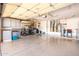 Spacious three car garage with epoxy floor and built in storage cabinets at 15133 W Wildfire Dr, Surprise, AZ 85374