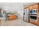 Kitchen with stainless appliances, granite countertops, and an island open to living room at 15133 W Wildfire Dr, Surprise, AZ 85374