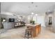 Open kitchen with island seating, seamlessly flowing into the living area for modern living at 15133 W Wildfire Dr, Surprise, AZ 85374