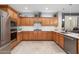 Well-appointed kitchen featuring modern appliances, ample cabinetry, and granite countertops at 15133 W Wildfire Dr, Surprise, AZ 85374