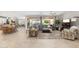Spacious living room with large sectional sofa and sliding glass doors leading to outdoor space at 15133 W Wildfire Dr, Surprise, AZ 85374