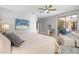 Cozy main bedroom featuring a sliding glass door, an ensuite outdoor seating area, and neutral decor at 15133 W Wildfire Dr, Surprise, AZ 85374