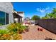 Private backyard offering play area and patio, surrounded by lush landscaping at 15423 N 22Nd Dr, Phoenix, AZ 85023