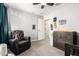 This bedroom features a rocking chair and lots of natural light and neutral colors at 15423 N 22Nd Dr, Phoenix, AZ 85023