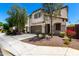 Inviting two-story home boasts stucco siding, a two-car garage, and lovely curb appeal with desert landscaping at 15423 N 22Nd Dr, Phoenix, AZ 85023