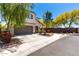 Attractive two-story home with a stucco facade, spacious driveway, and desert landscaping for curb appeal at 15423 N 22Nd Dr, Phoenix, AZ 85023