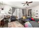 Comfortable living room with a sectional sofa, area rug, and plenty of natural light at 15423 N 22Nd Dr, Phoenix, AZ 85023